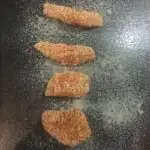 baby led weaning chicken nuggets on a baking tray ready to be cooked