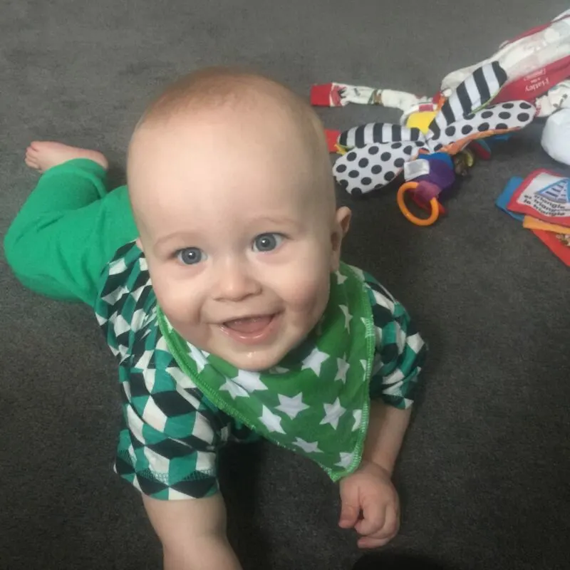 Dexter smiling while doing tummy time
