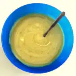 leek and potato soup for babies in a blue bowl