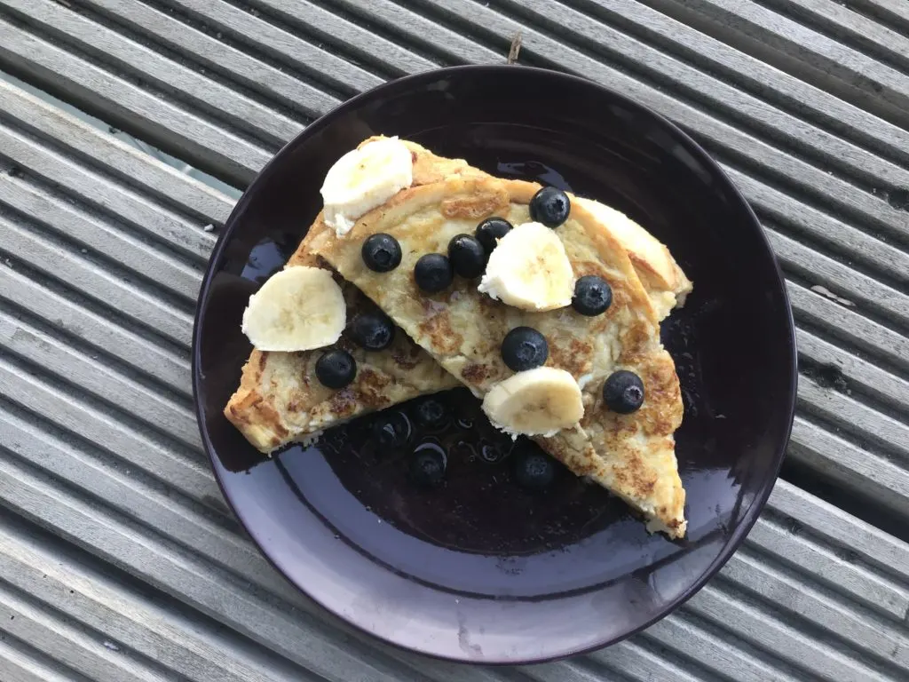 baby led weaning french toast sandwich topped with blueberries and bananas