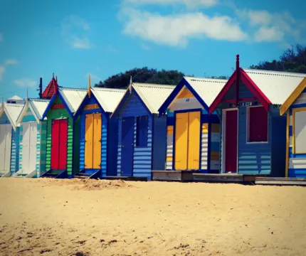 coloured huts on the beach in brighton