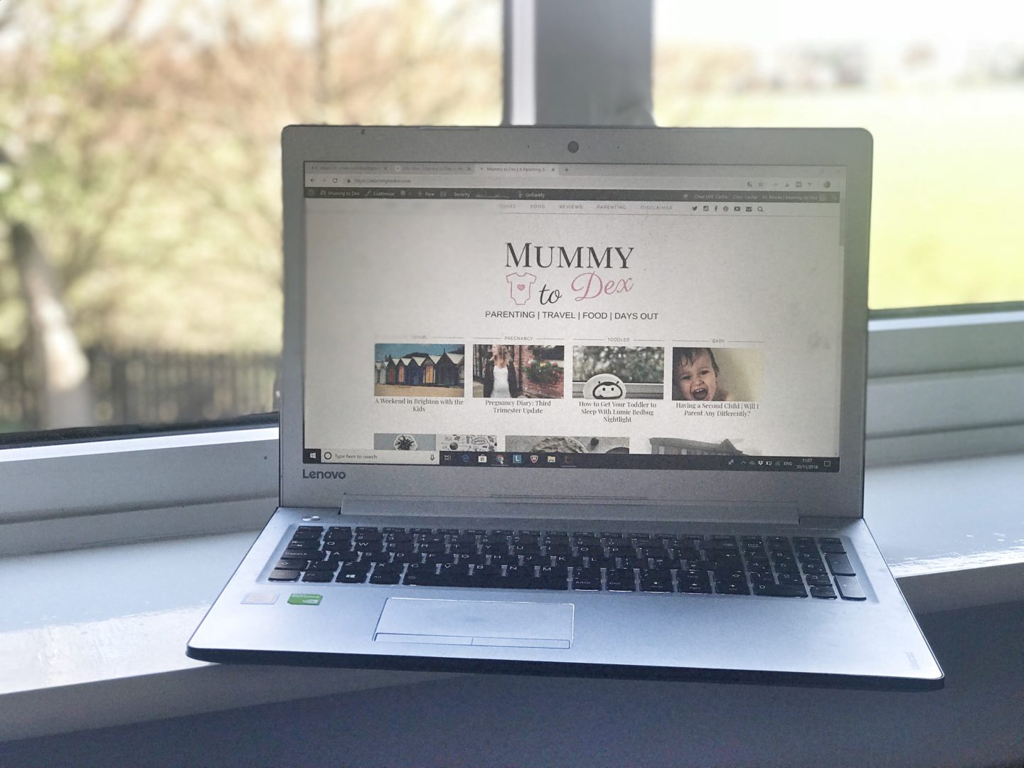laptop showing Mummy to Dex blog situated on a windowsill