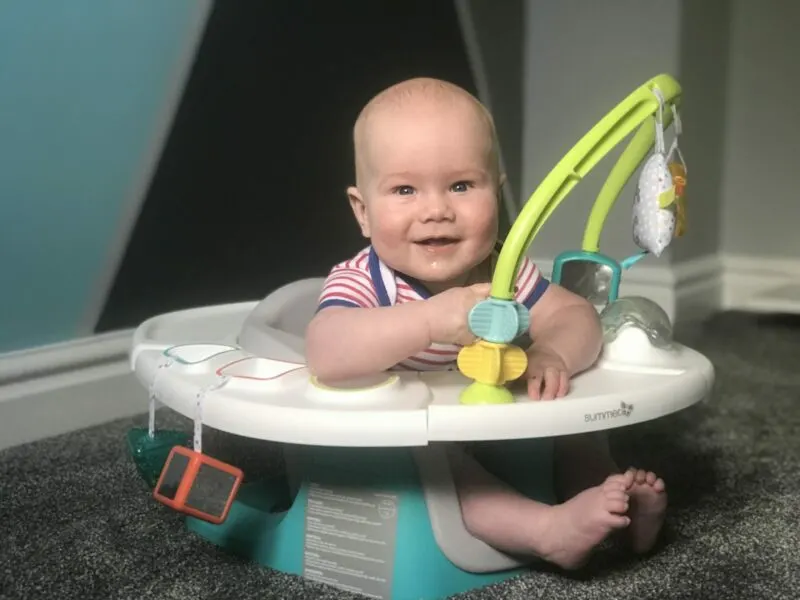 Felix in his Summer Delux 4 in 1 Superseat looking at camera smiling