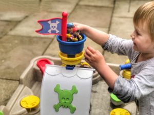 Dexter placing two pirates in the crow's nest of the little tikes anchors away pirate ship water table