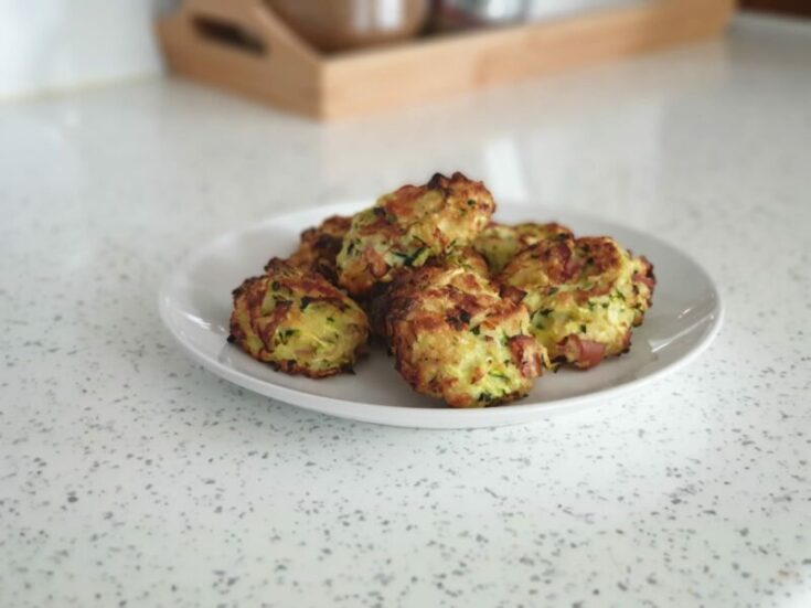 Baby Led weaning courgette bites on a plate in the kitchen