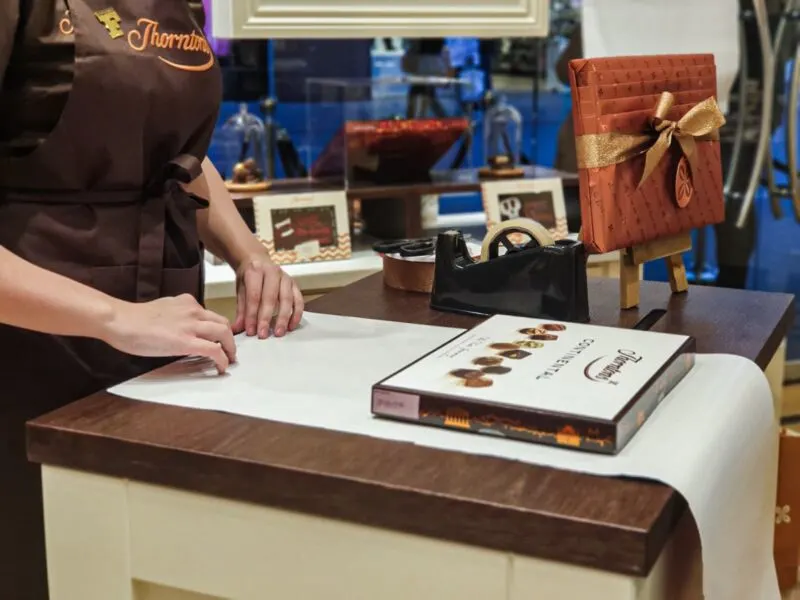 The box of chocolate sbeing wrapped by the gift wrapping service inside Thornton's new store in Liverpool One