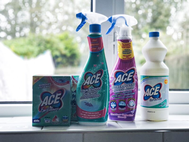 ACE range of products on windowsill with washing hanging on line behind