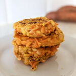 sweet potato hash browns stacked on a plate