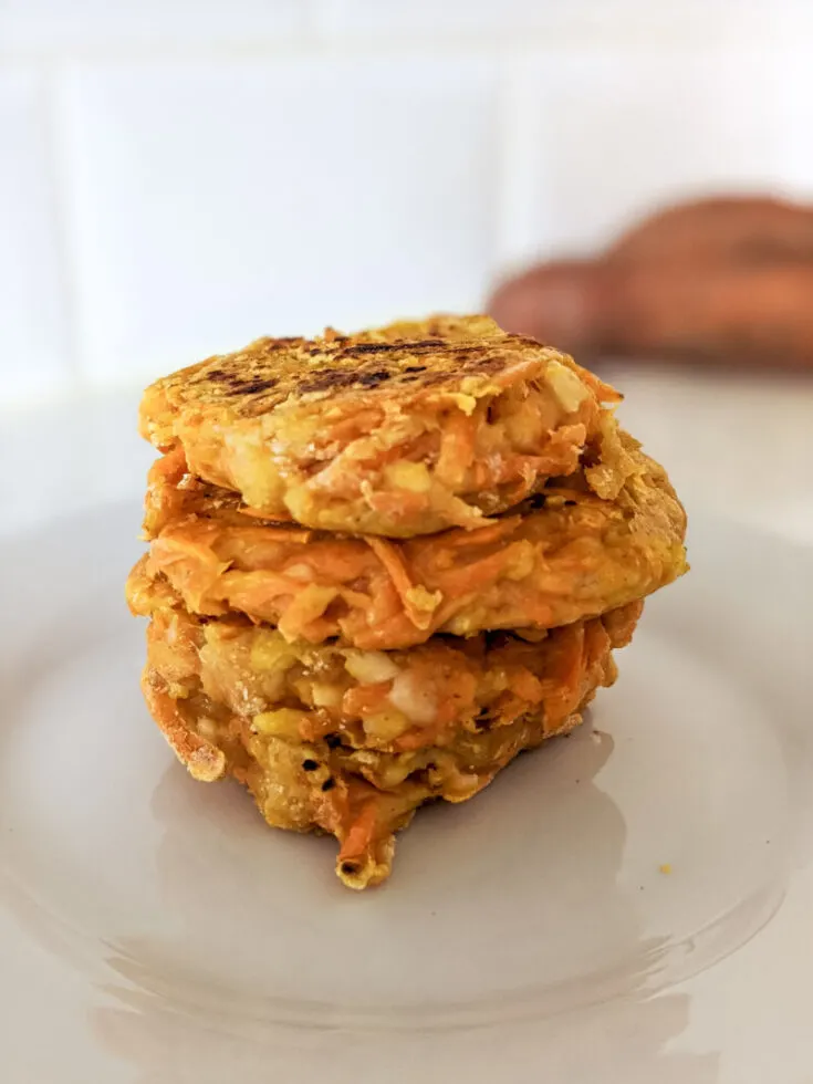 sweet potato hash browns stacked on a plate