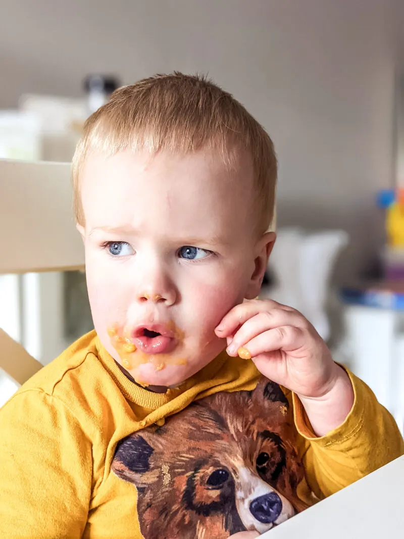 Felix covered in sweet potato soup for babies