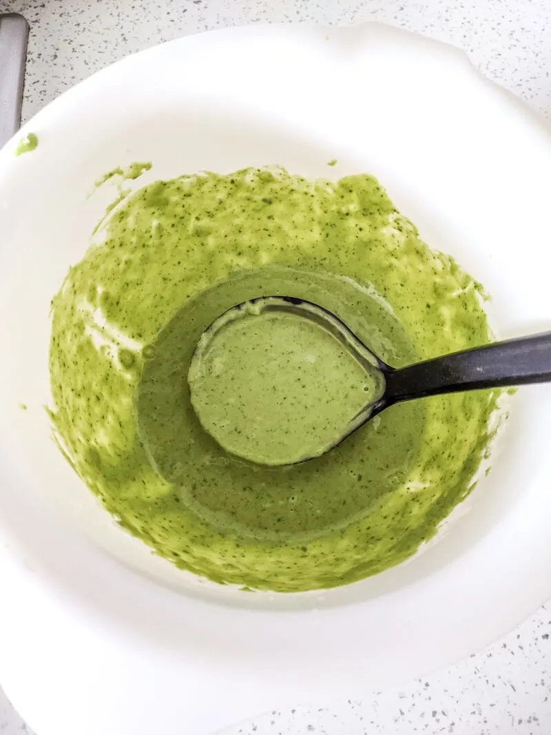 banana and spinach pancake batter mix in the bowl