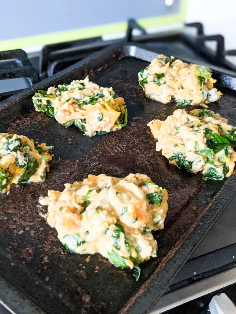 tuna, spinach and sweet potato patties on a baking tray