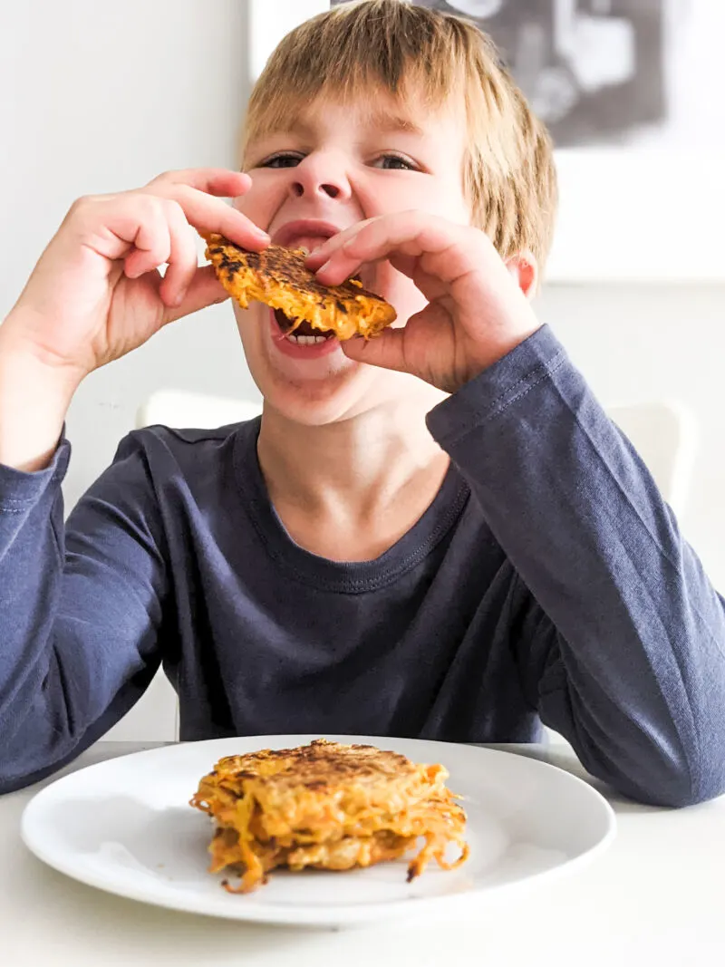 dexter eating hash brown potato cakes