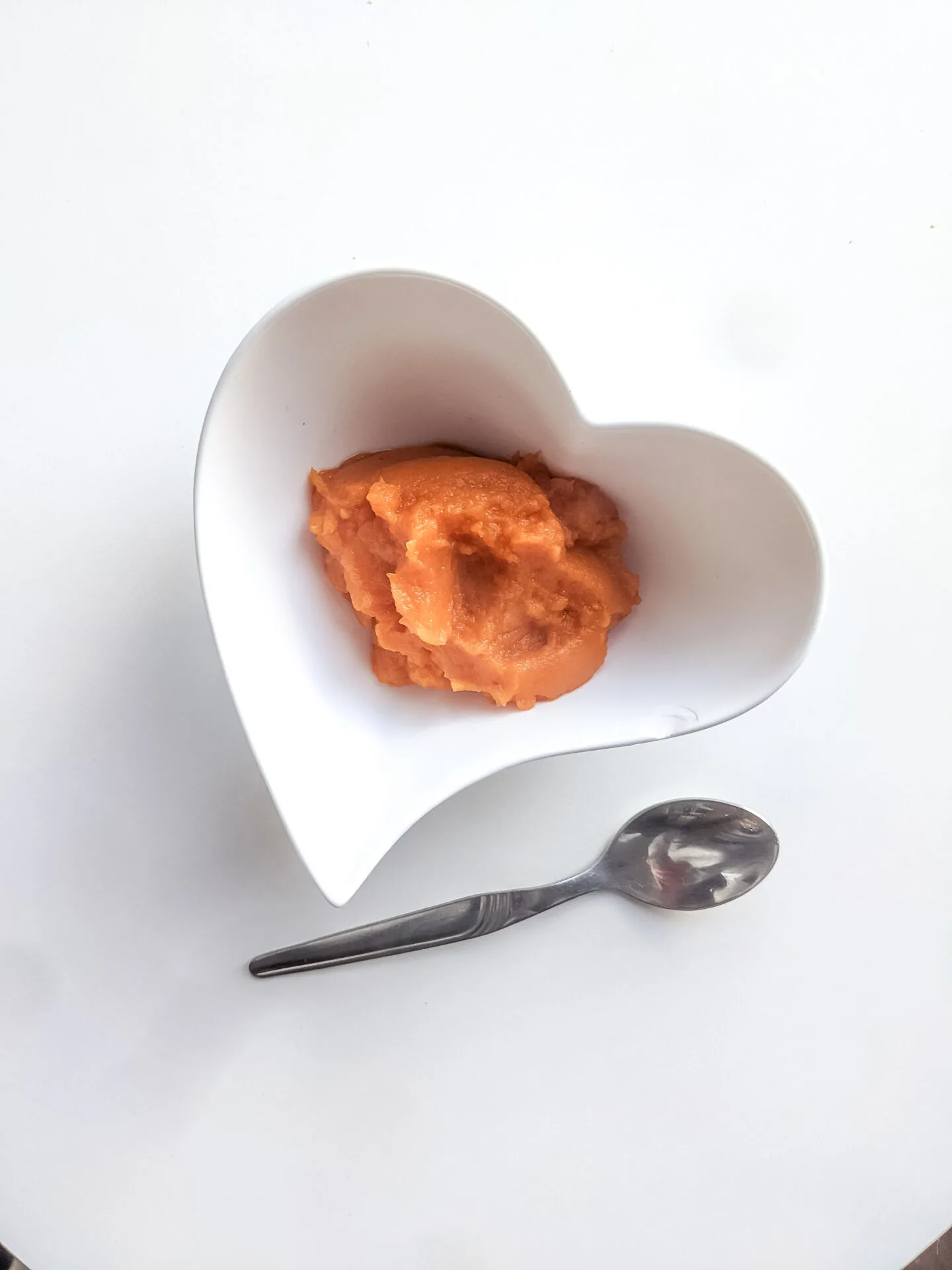 sweet potato mash for babies in a heart shaped bowl