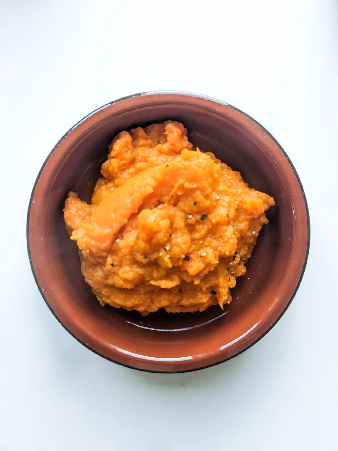 sweet potato and carrot mash in a bowl