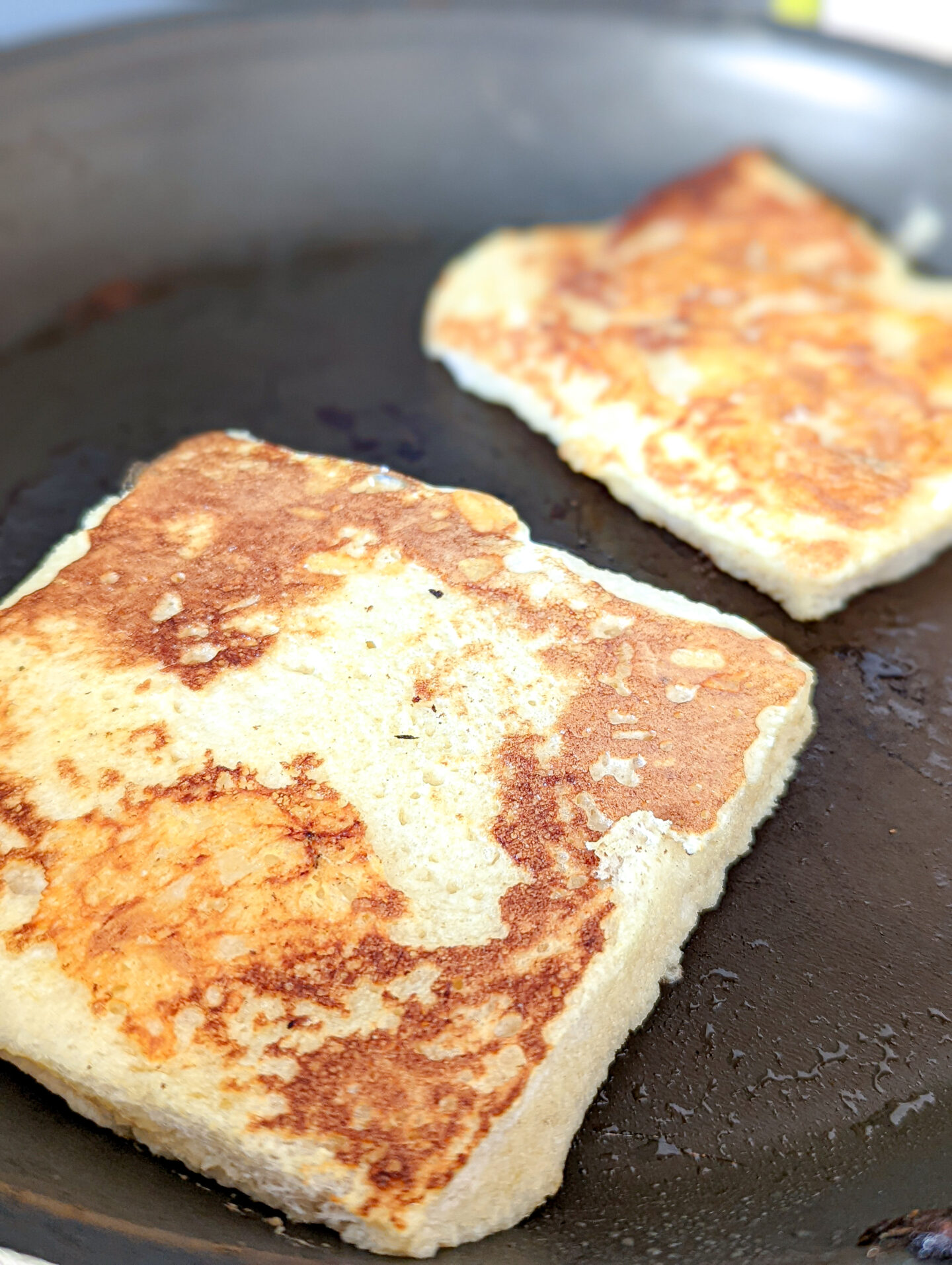 cheesy eggy bread in the pan