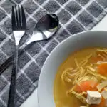 leftover turkey broth in a white bowl