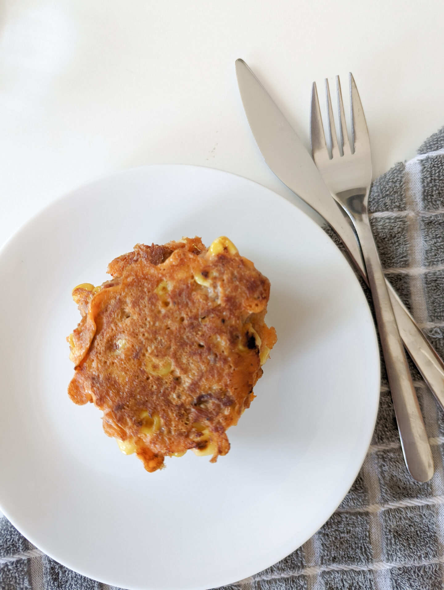 tuna and sweetcorn fritters with a knife and fork